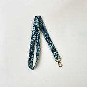 Batik Lanyard  Teal Ukir in a white box black ground and shown folded 