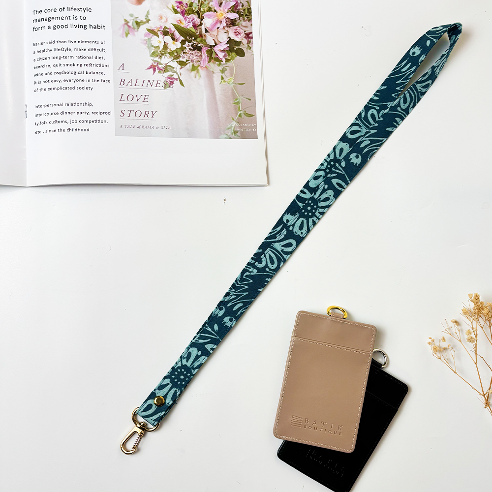 Batik Lanyard  Teal Ukir shown in a white box background and laid down flat 