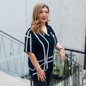 a woman posing in a lifestyle photo in a women's batik cuban in the pattern navy brush