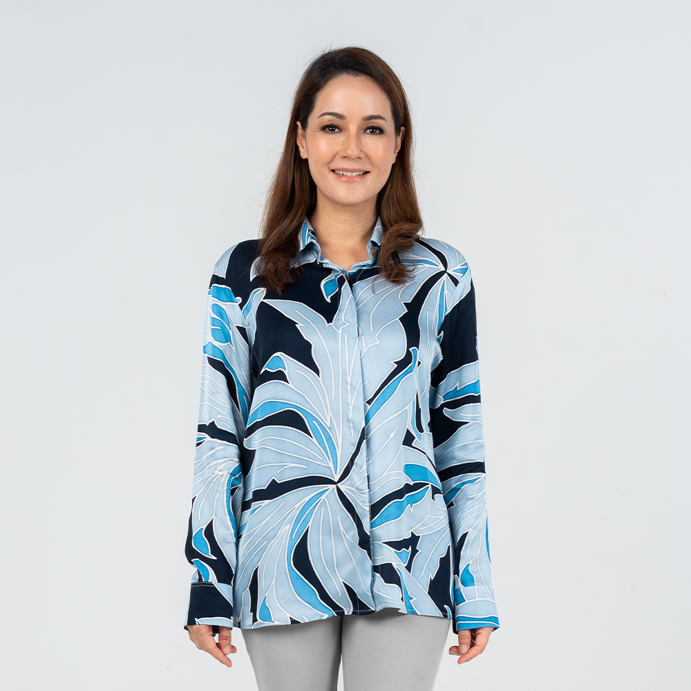 Front view of model wearing women's Moonlight Palma batik shirt with button-down front and structured collar