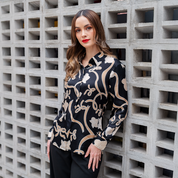 a woman in onyx fleur print women long sleeved in a lifestyle photo