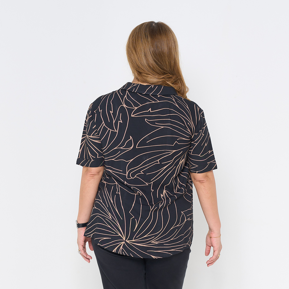a woman in the pattern onyx palma cuban shirt