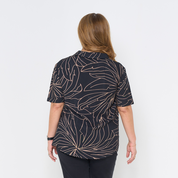 a woman in the pattern onyx palma cuban shirt