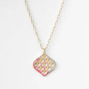 Necklace with a geometric pendant on a white background