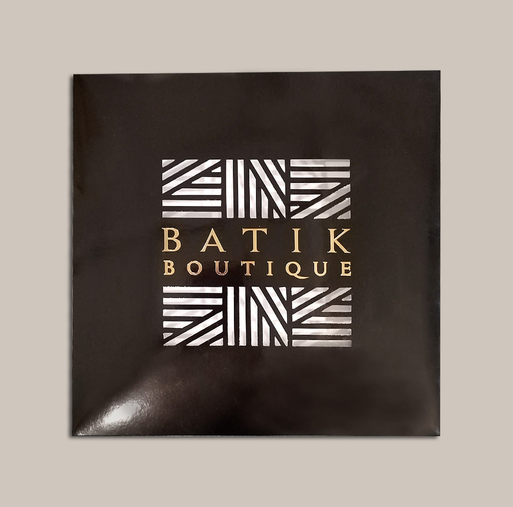 a batik boutique scarf box that's perfect for gifting against a neutral background