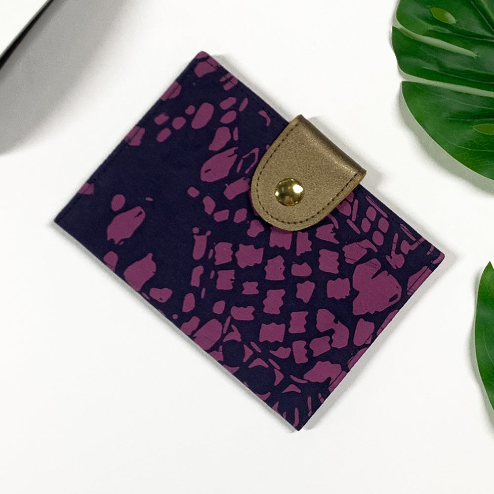 a picture of a passport cover made of batik in the pattern purple bintik 