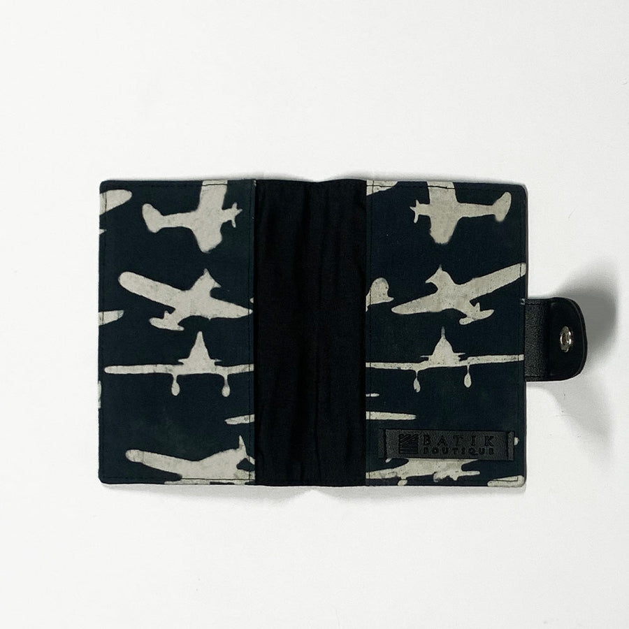 a passport cover photo showcasing the inside pattern in black airplane made of batik