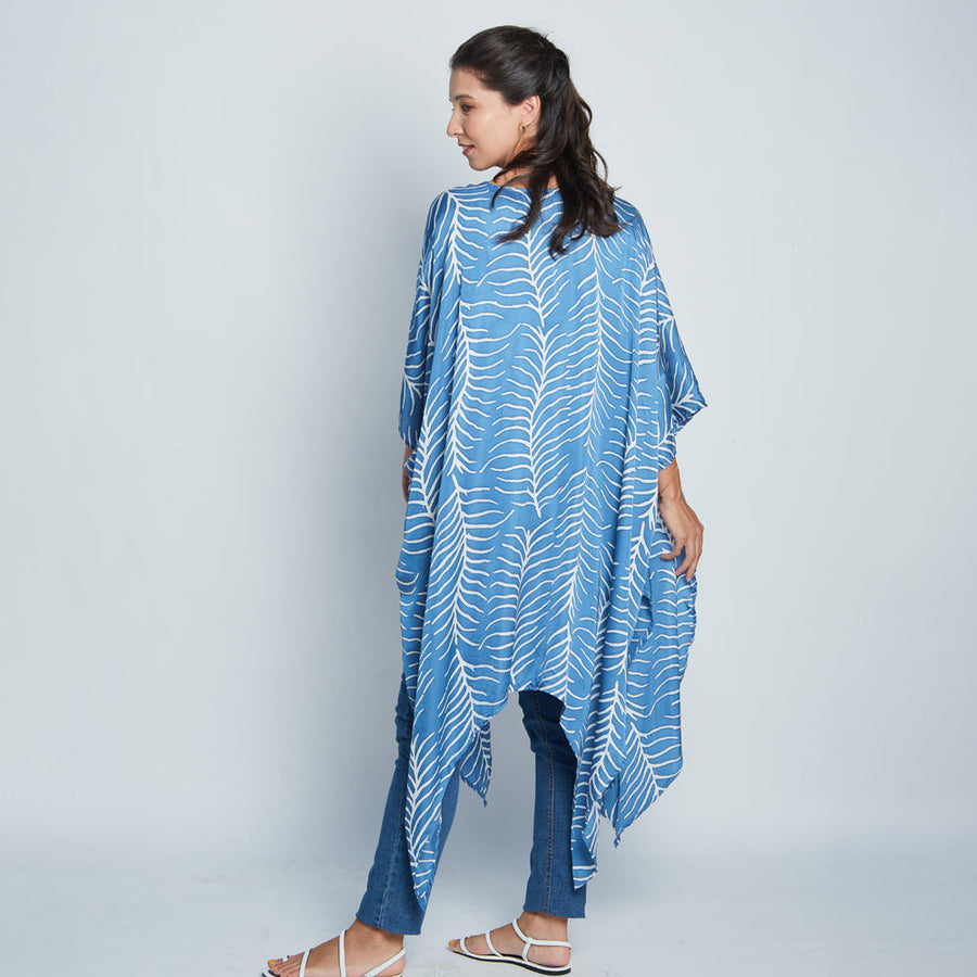 Back view of a model showcasing cotton silk batik Kimono in Cobalt Fern, handcrafted in Malaysia.