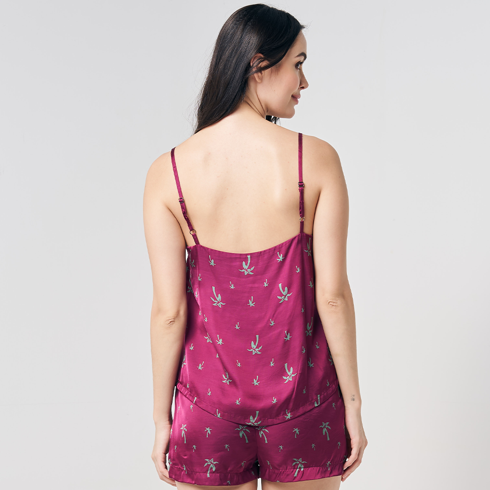 a shot showcasing the back details of a batik camisole in the print fuchsia palm against a neutral background
