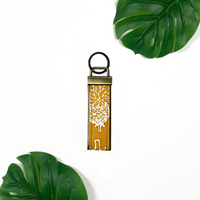 a photo of a batik ke fob in the pattern golden pineapple in a lifestyle photo
