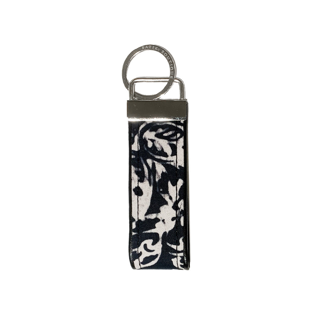 A frontside photo of batik key fob in black bunga pattern on a white color background