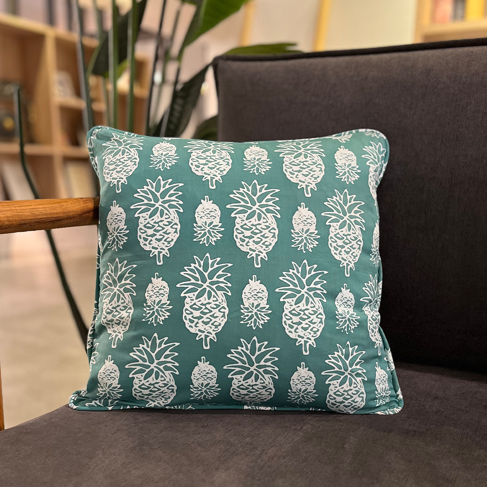 turquoise pineapple pillow made of batik in a lifestyle photo