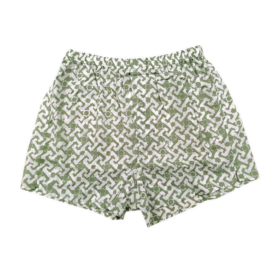 a front view of a batik boxer in green arabesque on a white background