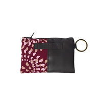 a photo of a card holder wallet in the pattern crimson lunar against a neutral background