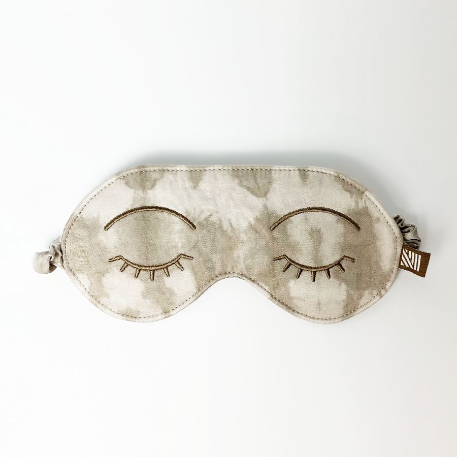 a white box photo of a shibori eye mask in the pattern mangosteen