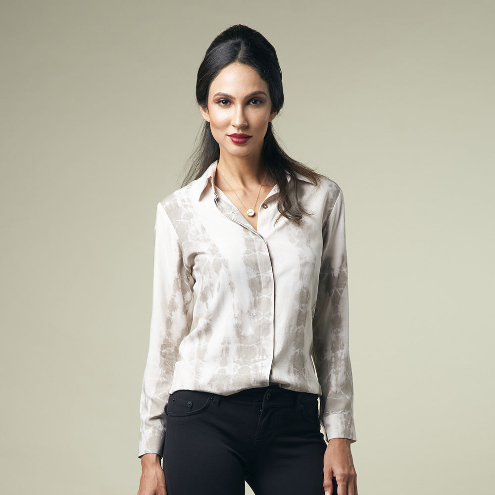 A model is posing in shibori long sleeved shirt in mangosteen pattern