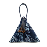 a photo showcasing the front of a bag made of batik in the pattern blue nautical fern in front of a neutral background