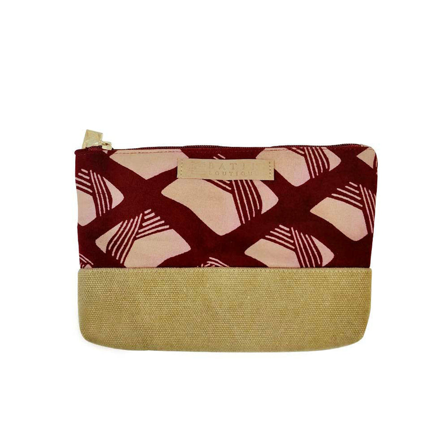 a batik zip pouch made of batik in the pattern crimson nasi lemak in front of a neutral background