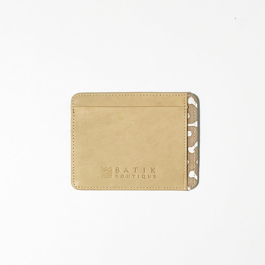 A whitebox photo of sustainable batik card in Latte Kompas engrave on is Batik Boutique logo