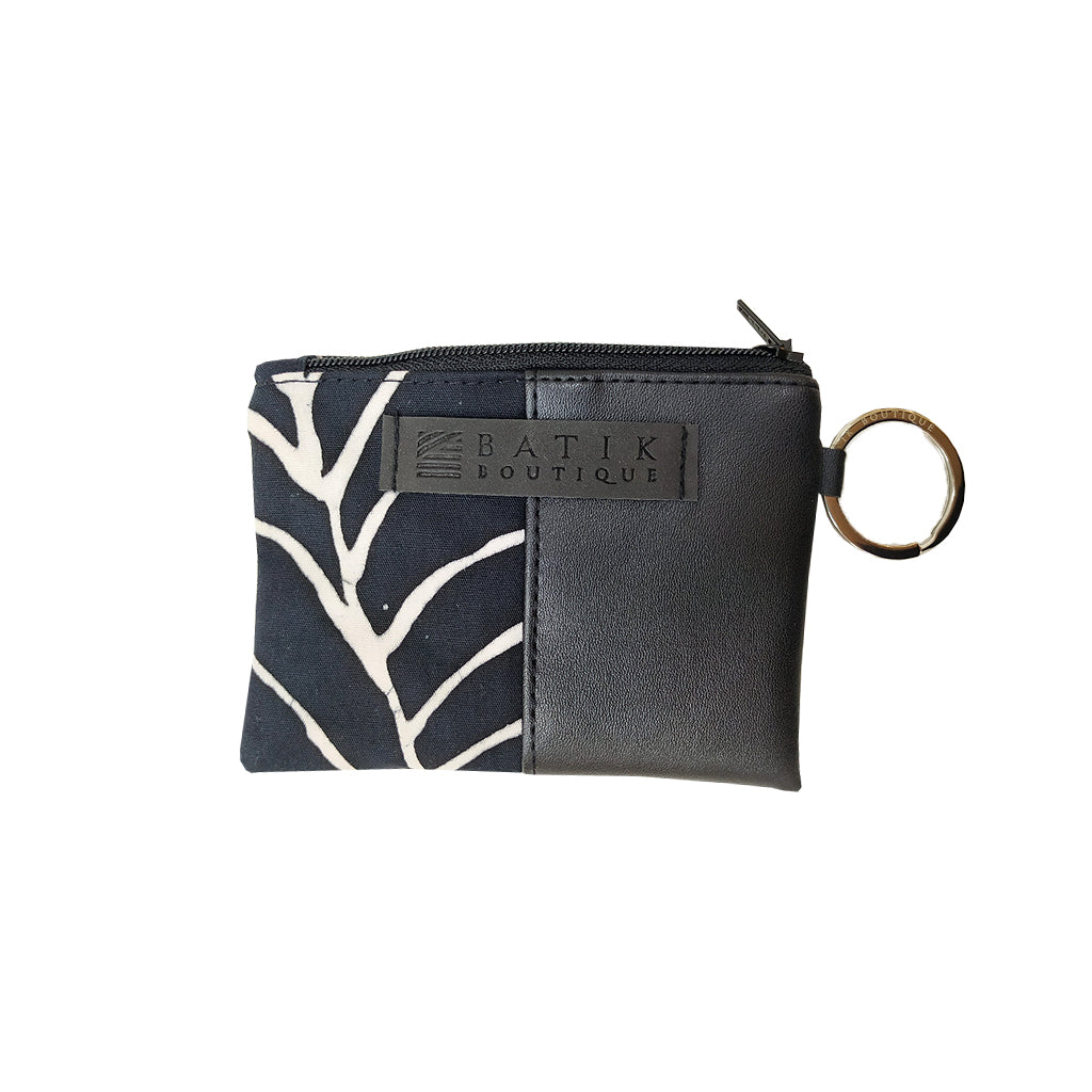 a photo of a card holder wallet in the pattern black fern against a neutral background