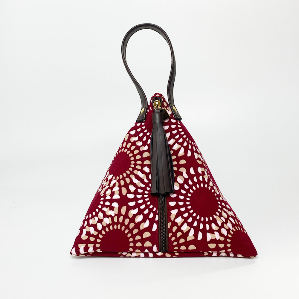 A whitebox photo of batik ketupat bag in crimson lunar pattern facing front