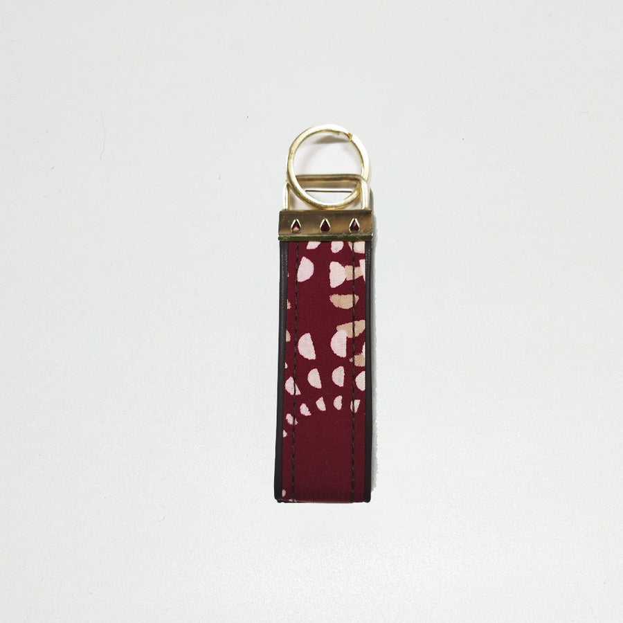 A white box photo of batik key fob in Crimson Lunar