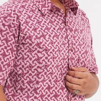 a closeup shot of a man wearing a popular pattern crimson arabesque authentic batik