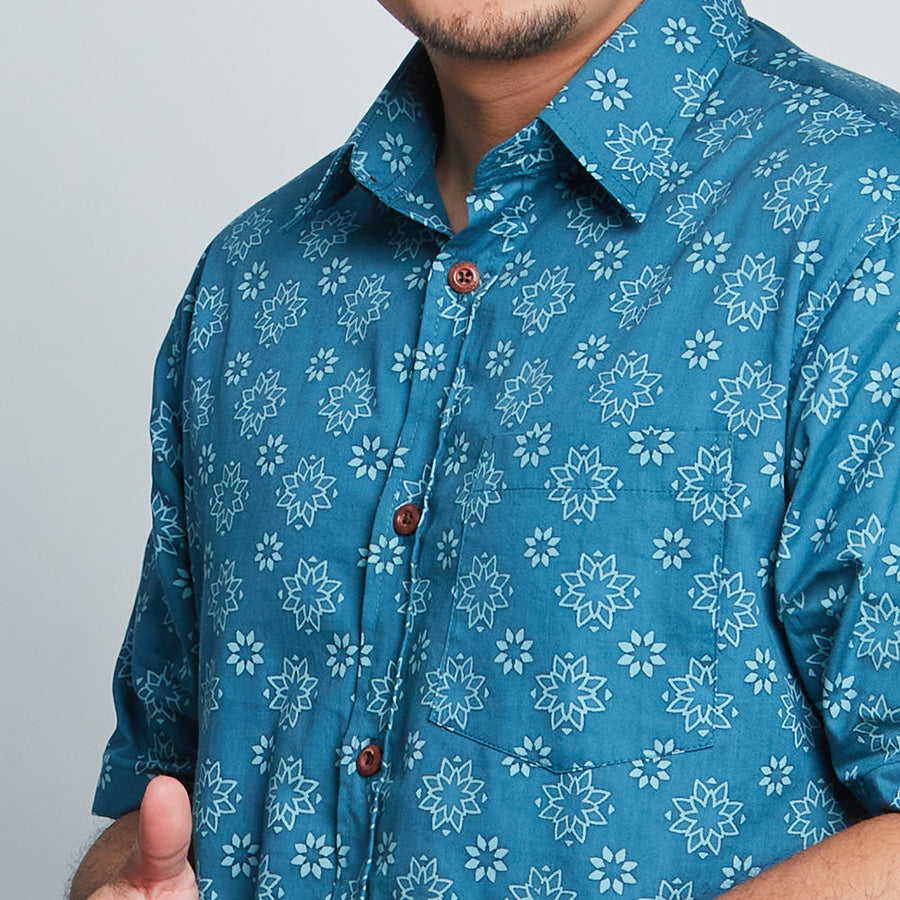 a close up photo of men shirt in ocean bintang pattern 
