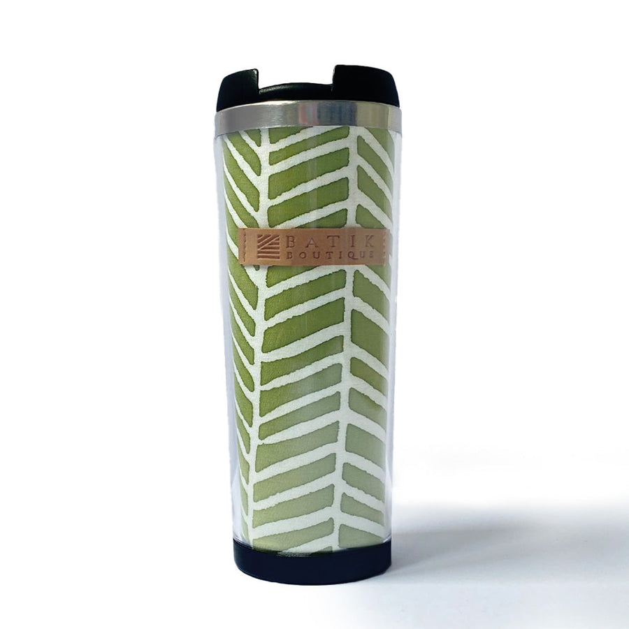 a front view of sage banana leaf tumbler made of batik on a neutral background