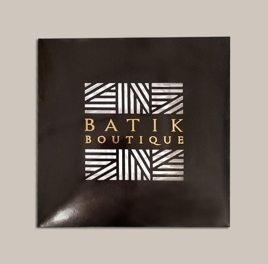 a photo of a black box from batik boutique that's perfect for gifting scarf